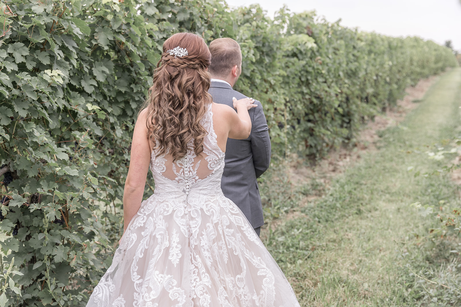 Groom sees bride during first look