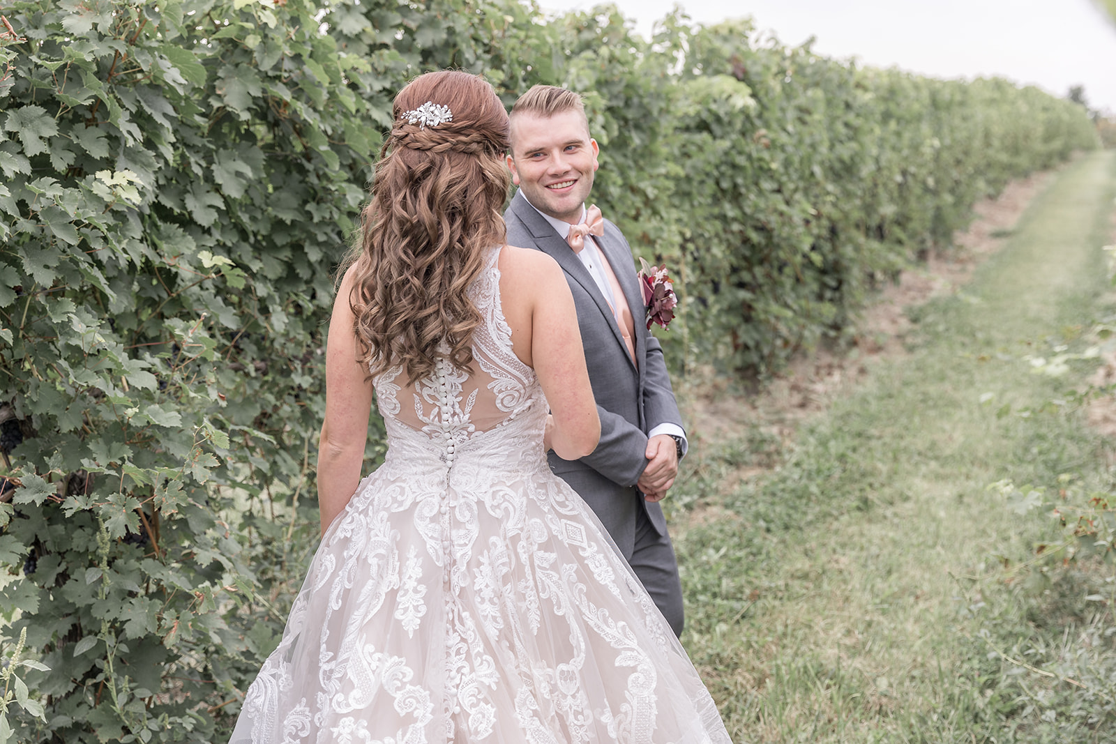 Groom sees bride during first look