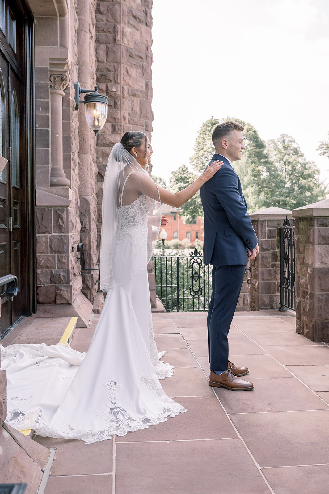 Groom sees bride during first look