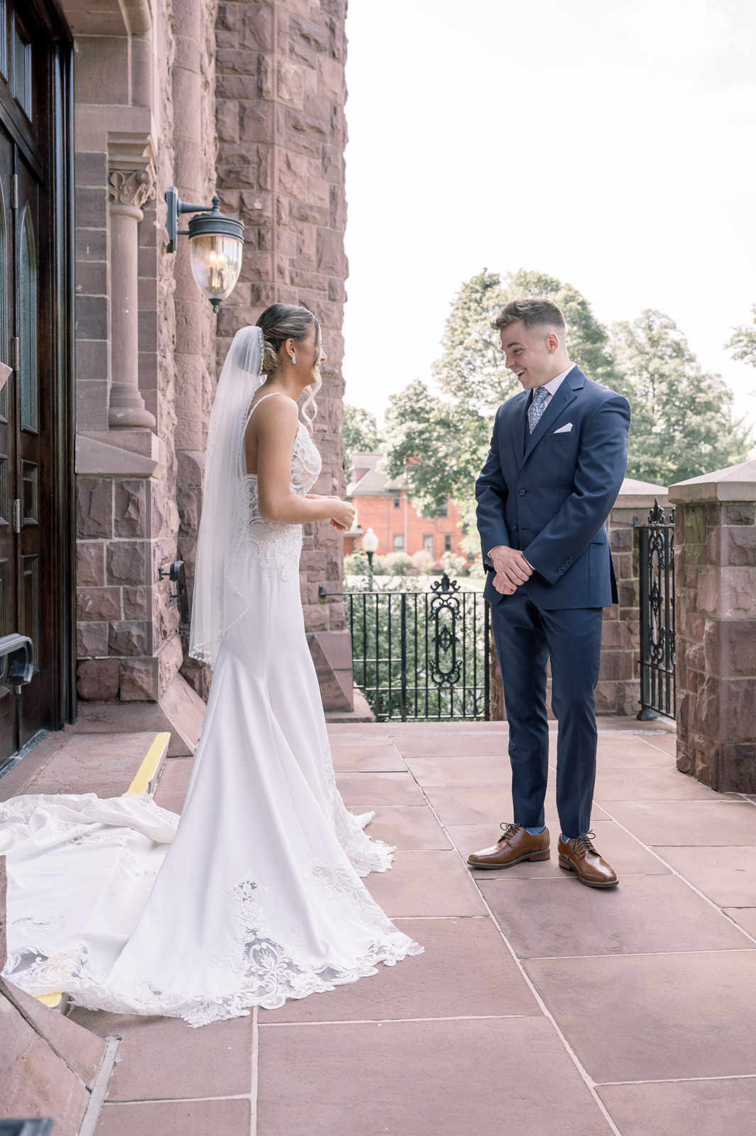 Groom sees bride during first look