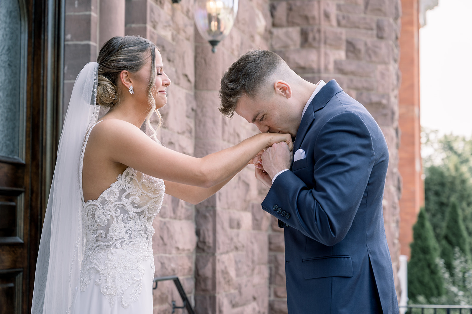 Groom sees bride during first look