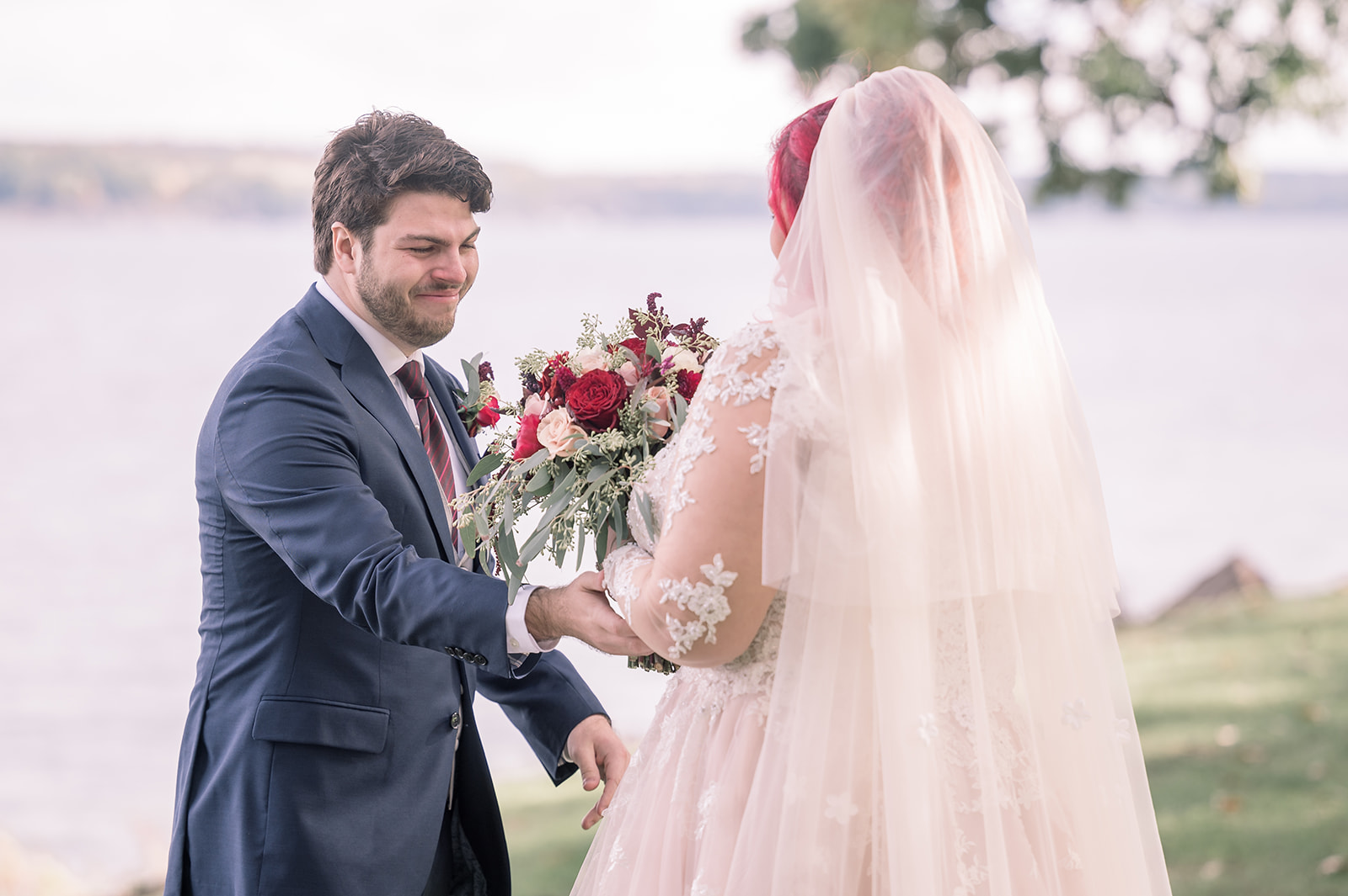 Groom sees bride during first look