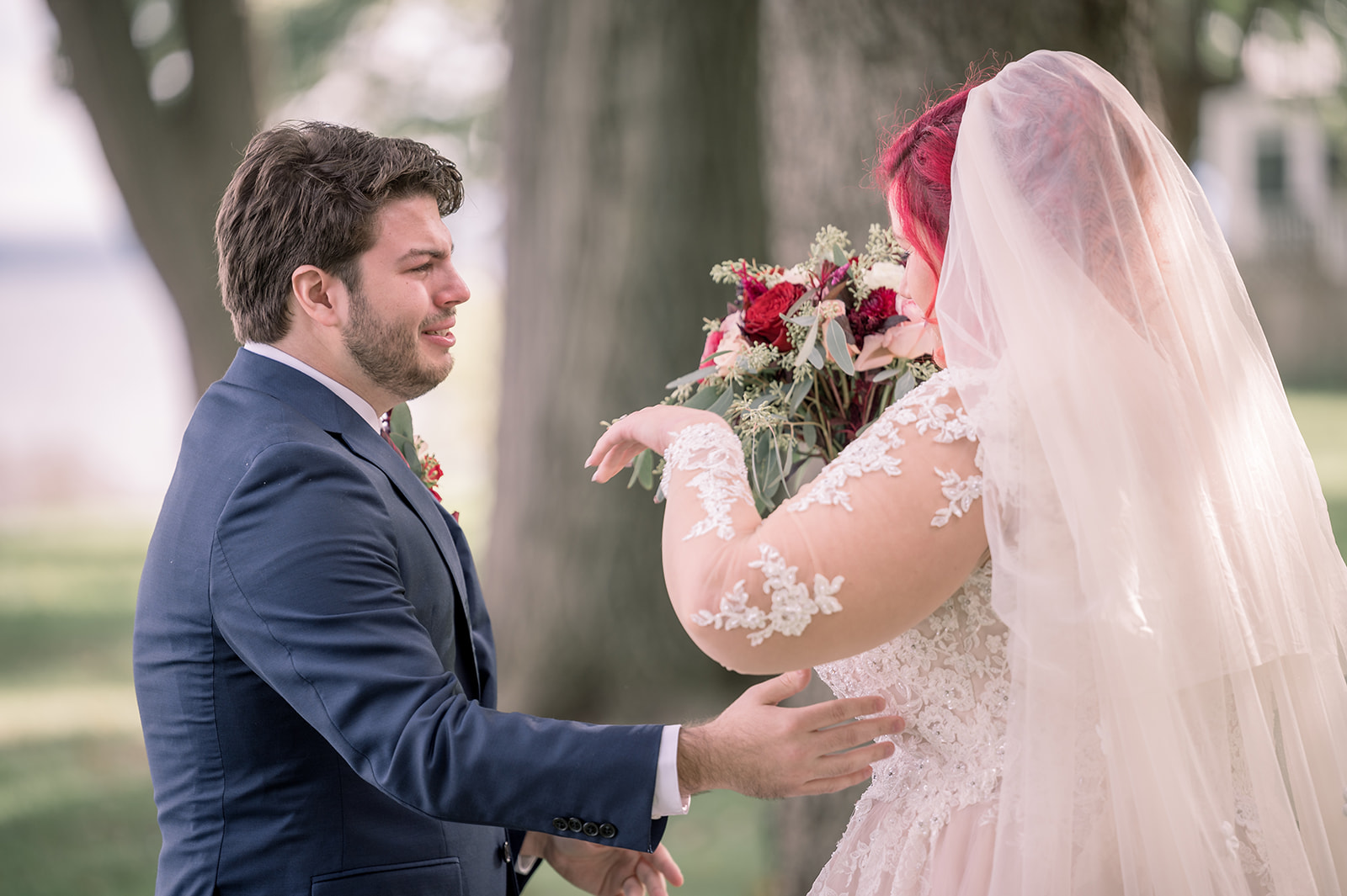 Groom sees bride during first look